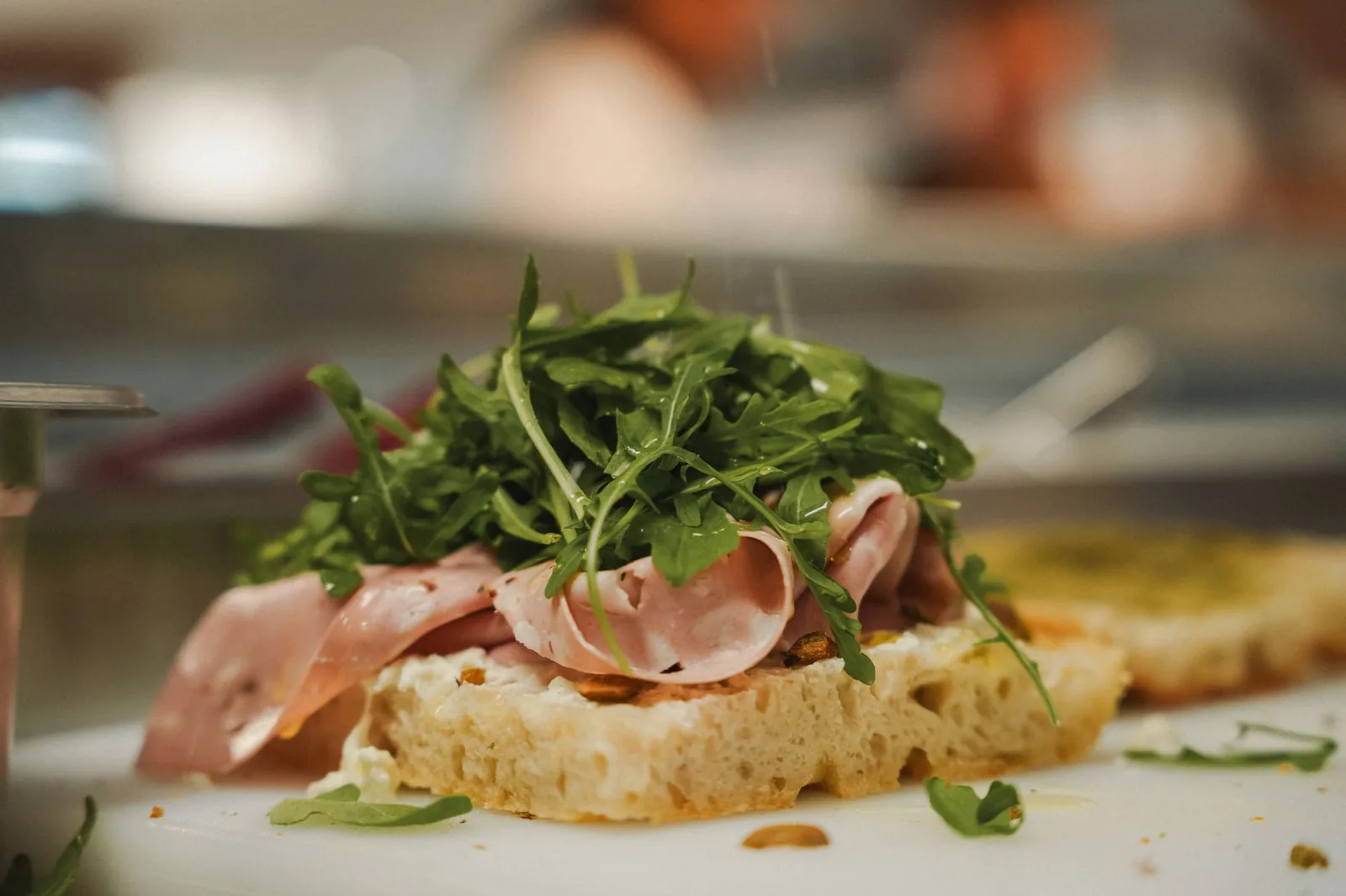 Mortadella and rocket piled on a slice of fresh focaccia
