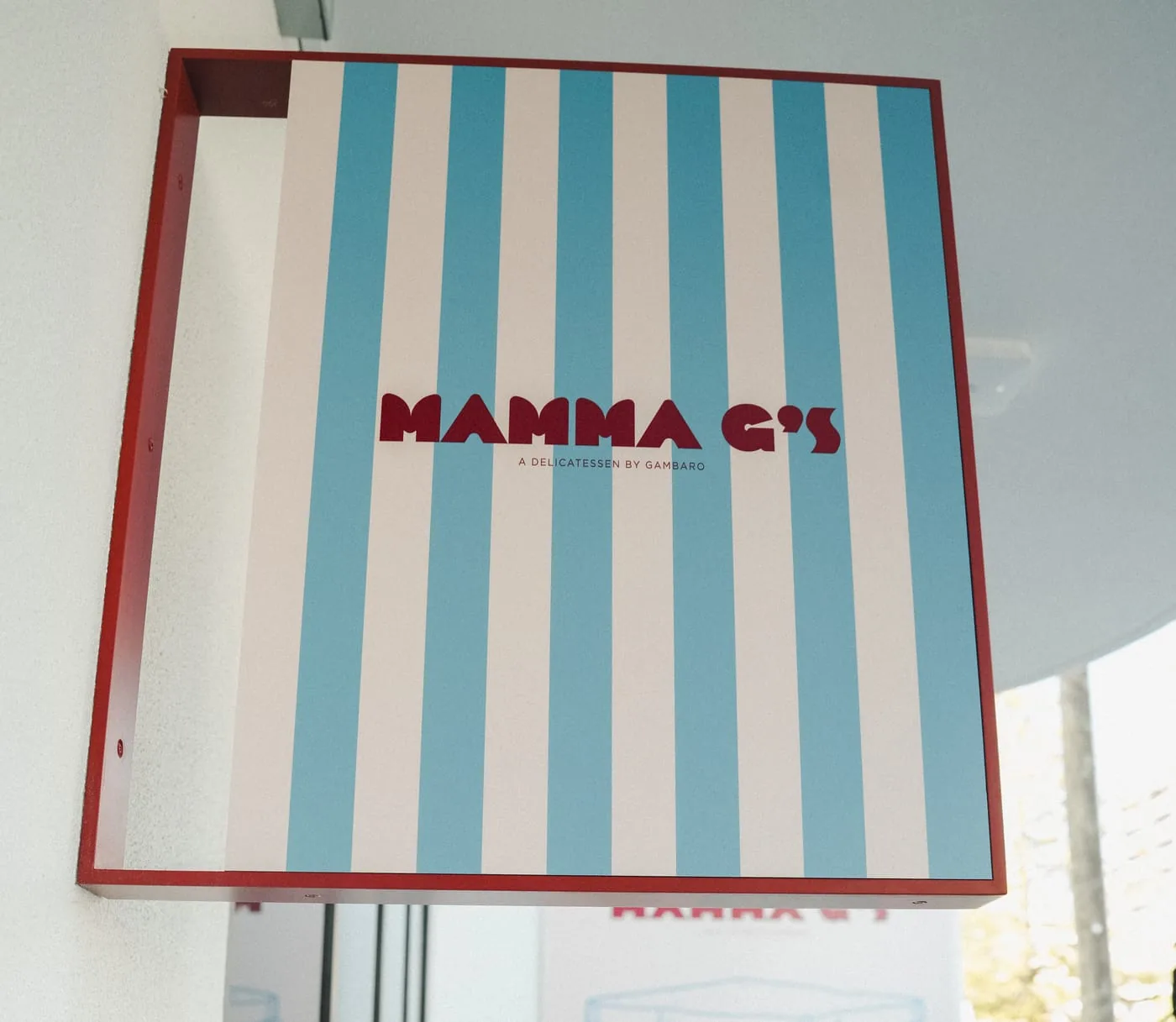 The Mamma G's blue and cream striped sign above the shopfront